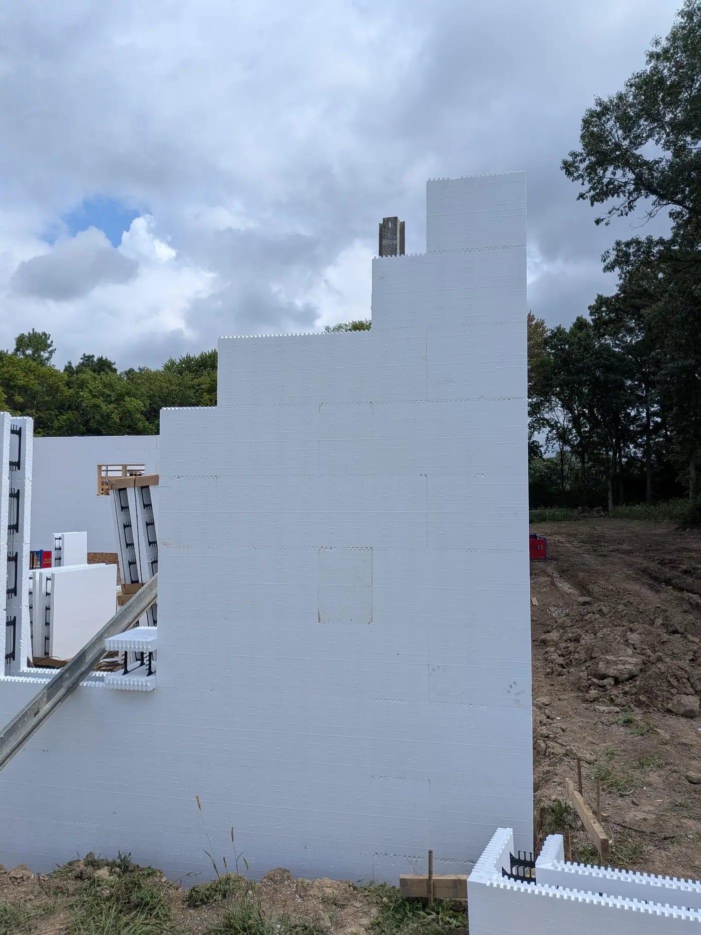 A stepped ICF gable wall stacked to full height with bracing on one side